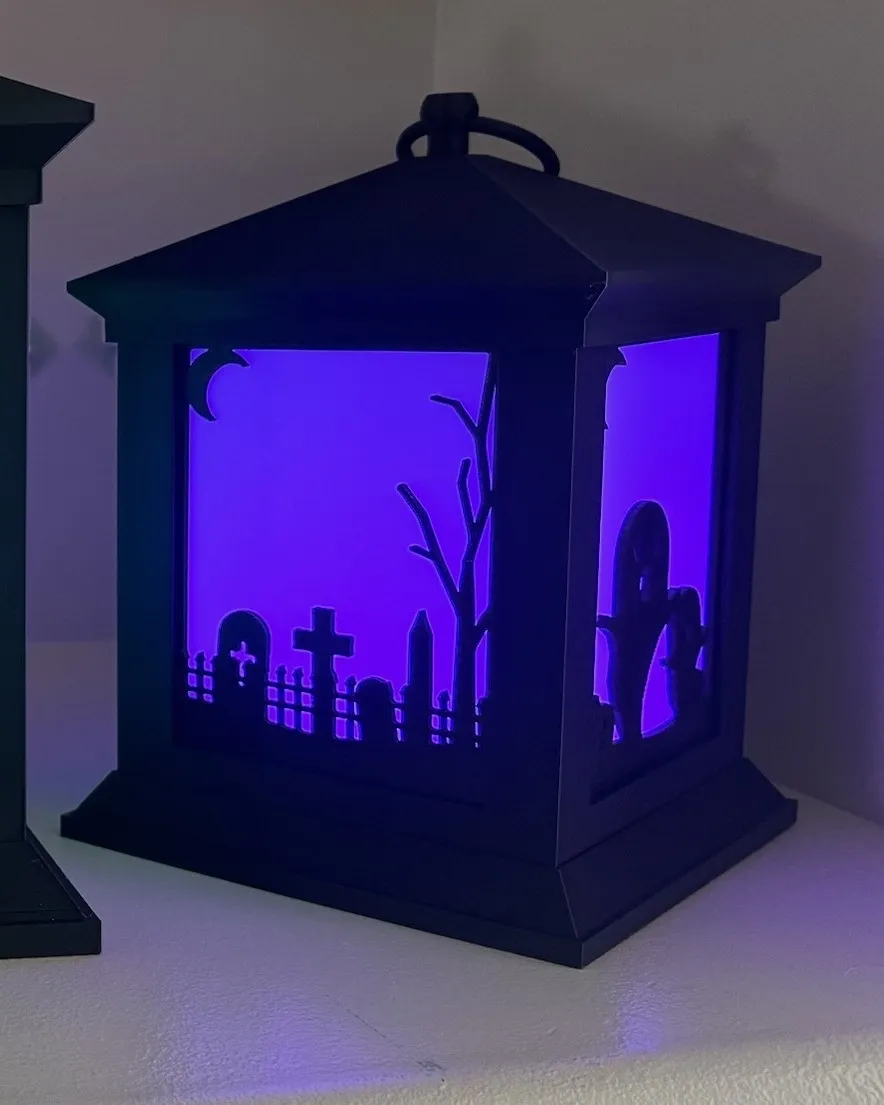 8 inch lantern with a graveyard scene glowing purple